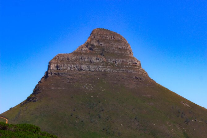 Table Mountain and Cape Peninsula Tour with Penguins - Muizenberg Beach brings the loop back